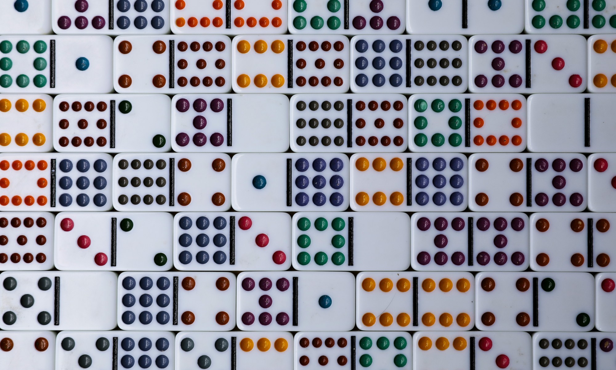 White and colorful dominoes filling the image.